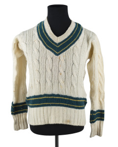AUSTRALIA 1961: The Australian team long-sleeved jumper issued to BRIAN BOOTH, with his name ("BOOTH B.") in ink on the manufacturers label; match worn. Offered together with an official postcard of the team and an official team sheet signed by Booth and the other 18 members of the touring party. (3 items).Provenance: The estate of A.E.James, Physiotherapist to the Australian Cricket Team, 1930s-1960s.