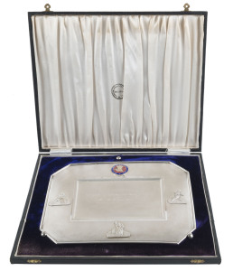 AUSTRALIA IN INDIA - 1964: A silver plaque in a velvet and silk lined presentation box (from the Lakshini Jewellery Company of Bangalore) with BOARD OF CONTROL FOR CRICKET IN INDIA coat of arms at the top and with the engraved greeting "WITH THE BEST COMPLIMENTS OF THE BOARD OF CONTROL FOR CRICKET IN INDIA to MR. A.E. James (MASSEUR) AUSTRALIAN CRICKET TOURING TEAM 1964". Overall 25.5 x 30cm.