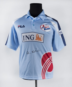 SIMON KATICH, original signature on N.S.W. "SpeedBlitz Blues" team shirt. [Simon Katich played 56 Tests & 45 ODIs for Australia 2001-10].