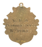 1939 V.F.A. PREMIERSHIP Medal in 9ct gold; awarded to W. SPOKES of the Williamstown Football Club. The premiership was won by Williamstown, coming from fourth on the ladder to defeat Brunswick by nine points in the Grand Final on 7 October in front of 47, - 2