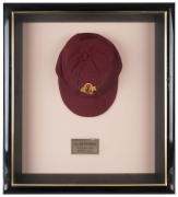 ALLAN BORDER'S QUEENSLAND CRICKET CAP, deep red, embroidered yellow "QCA" monogram on front, "Albion" label inside endorsed "AB" & signed "Allan Border". Fine condition. Attractively framed. [Border represented Queensland in 98 matches between 1980 and 19 - 2