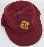 ALLAN BORDER'S QUEENSLAND CRICKET CAP, deep red, embroidered yellow "QCA" monogram on front, "Albion" label inside endorsed "AB" & signed "Allan Border". Fine condition. Attractively framed. [Border represented Queensland in 98 matches between 1980 and 19 - 5