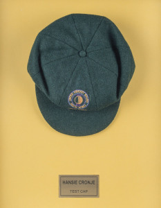 HANSIE CRONJE'S MATCH WORN SOUTH AFRICAN TEST TEAM CAP 1993/94, with U.C.B. South Africa ball and wicket logo on front and "Sacop Brand" label signed in ink "HANSIE CRONJE". Attractively framed.