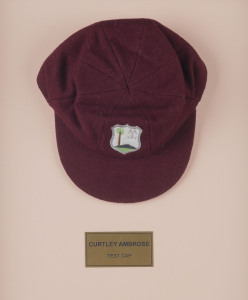 CURTLY AMBROSE'S WEST INDIES TEST TEAM CAP, maroon wool with the West Indies logo embroidered to front. Cap by Bill Edwards of Swansea with Ambrose's name in pen on the label (partly overwritten). Attractively framed. [Ambrose played in 98 Tests for the W