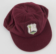 CURTLY AMBROSE'S WEST INDIES TEST TEAM CAP, maroon wool with the West Indies logo embroidered to front. Cap by Bill Edwards of Swansea with Ambrose's name in pen on the label (partly overwritten). Attractively framed. [Ambrose played in 98 Tests for the W - 5