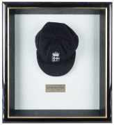 DEVON MALCOLM'S ENGLAND HOME TEST TEAM CAP, navy blue wool with embroidered Crown over three lions on front, with "D.M." to inside label. Very fine condition. Attractively framed. - 2