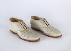 A pair of miniature ceramic cricket shoes, circa 1900; no maker's mark, but both stamped on the heel "Rd No:335843" (2).