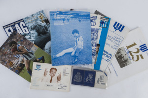 NORTH MELBOURNE: 1955 Membership Card, 1957 North Junior Membership Card, 1958 Patron's Membership Card together with a 1963 - 1994 range of Annual Reports (6), a Schimmelbusch dinner menu and a 1995 20th Anniversary magazine signed by Ron Barassi. (11 items).