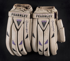 GRAHAM HICK'S batting gloves: a pair of match-used Duncan Fearnley brand gloves, both signed by Hick. [Rhodesian born, Hick played for Zimbabwe 1983-86 and for England 1991 - 2001 appearing in 65 Tests and made more than 41,000 runs in all First Class mat
