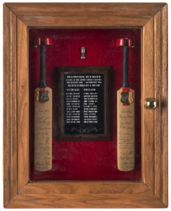 THE BI-CENTENNIAL TEST MATCH, SYDNEY, Jan/Feb.1988An attractively presented display comprising of two miniature bats, each with a metal engraved plaque, one signed by the Australian team, the other signed by the English team, and between the bats an engraved plaque naming the members of both teams and providing details of the match....which ended in a draw.