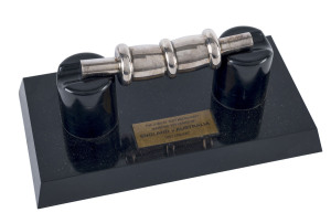 1977 Jubilee Test Match at Lords, England v Australia, Centenary Bail, Silver Plate, with "Scroll of Honour" rolled up inside showing details of the match with facsimile autographs of both teams; with display stand in original box, the box cover signed by Gary Cosier.Provenance: The Gary Cosier Collection, with Certificate from Leski Auction No.194, Lot 179, March 2002 (signed by Cosier).