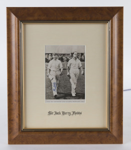 JACK HOBBS, pen signature on a photograph of him walking out to bat with Herbert Sutcliffe at Birmingham in 1924. Framed & glazed; overall 35 x 29cm.