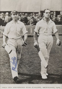 JACK HOBBS, pen signature on a photograph of him walking out to bat with Herbert Sutcliffe at Birmingham in 1924. Framed & glazed; overall 35 x 29cm. - 2