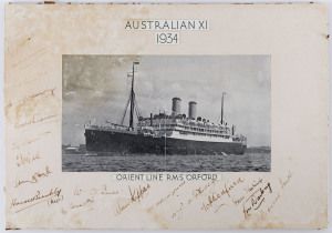 A mounted display titled "AUSTRALIA XI 1934" and showing the Orient Line R.M.S.Orford, which carried the Australian Team to England. The complete touring party of 18 has signed (in pen) to the mount but most of the autographs are damp affected. 