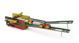 Kuramochi "Over the Hill" tin plate wind-up toy (which is also marked "Alps"). The toy is constructed of painted tin and has a strong wind up motor which works well. The 3 orange ramp pieces detach so the whole toy can be placed in it's box (which lacks the label). After the motor is wound the car (marked "C.K." in a diamond) is placed on far end of the ramp and released - it rolls down the ramp till the 2 ears on the side of car connect with pins on arms attached to motor - arms then lift car.