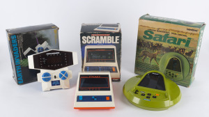 SCRAMBLE Futuretronics by Tomy Kogyo; together with EARTH INVADERS by CGL, and SAFARI electronic game, all in original boxes, (3 items)