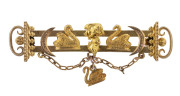 CHARLES HENRY MAY Western Australian goldfields brooch showing swans and crescents flanking a natural nugget specimen with swan pendant drop lower centre, stamped "18ct", 5.5cm long, 6.4 grams - 2