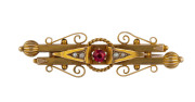 A yellow gold bar brooch set with red stone and seed pearls by T. WILLIS & SONS, Melbourne stamped "15ct, W" with unicorn mark 5.5cm, 5.5 grams - 2