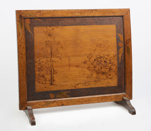 A poker work fire screen, signed and titled lower left "The Lake, ...M. Norris", circa 1920, ​65cm high, 70cm wide