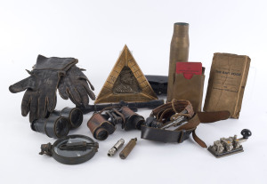 Military group comprising gloves, compass, lighter, binoculars, gun scope, headset, telegraph key, Sir John Monash cribbage board, whistle, artillery shell, soldiers pocketbook and pay book plus waterproof edition of "The Raft Book" with world charts. (15