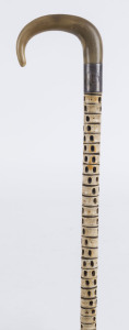 A walking stick, stingray vertebrae with horn handle and silver collar, 19th century, 87cm high