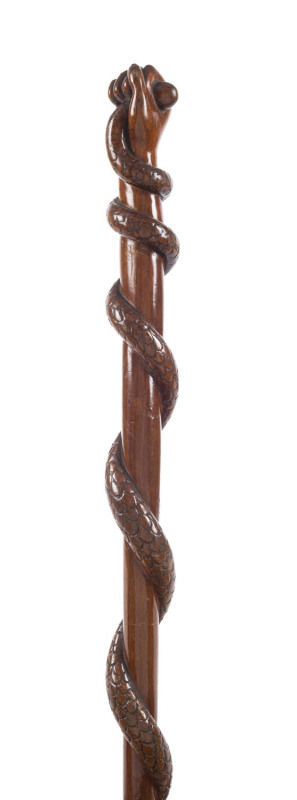 An Australian cedar walking stick, carved fist with entwined serpent, 19th century, 90cm high