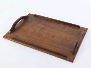 An Australian serving tray, finely grained fiddleback black, circa 1910, ​45cm across the handles