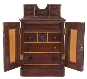 An Australian apprentice cabinet, finely crafted as three pieces of furniture being a mirrored wardrobe, a Duchess top and a chest of drawers, Australian cedar and pine, circa 1880, (missing mirror top), 44cm high, 29cm wide, 19cm deep