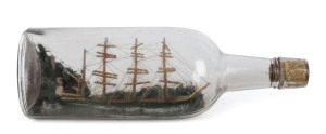 A ship in a bottle with four masted tallship, ​26cm long