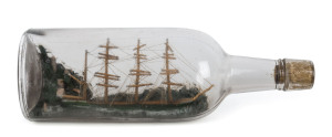 A ship in a bottle with four masted tallship, 26cm long