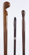 Three Australian walking sticks, one made from a propeller, one fiddleback blackwood, and one cane with silver plaque "W.H. BALMAIN, BEGA, N.S.W.", 19th and 20th century, the largest 97cm high