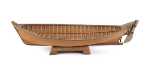 A clinker model boat made from huon pine boards with copper rivets, signed "C.E. DAVIES, Lochsport, Vic. Australia", late 19th early 20th century, ​77cm long
