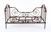 A salesman's sample antique cast iron daybed, 19th century, 36cm high, 57cm wide, 27cm deep