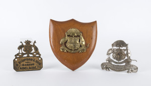 Three Australian coats of arms, cast metal one on timber shield, 19th century, timber shield 19.5cm high