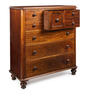 A Colonial six drawer chest with unusual staggered top drawers, beautifully selected grains of cedar, huon pine secondary timbers with blackwood knobs, Tasmanian origin, circa 1860, 140cm high, 123cm wide, 55cm deep