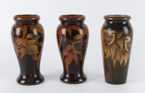 Three pokerwork kookaburra vases, circa 1930, the tallest 20.5cm high