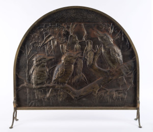 An embossed brass fire screen with laughing kookaburras, early 20th century, 67cm high, 75cm wide,