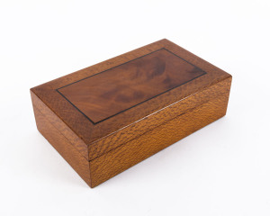 A silky oak box inset with satinwood panel and ebony stringing, Queensland origin, late 19th century, 7.5cm high, 25cm wide, 15cm deep