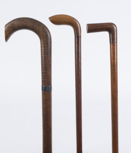 Three Australian walking sticks, blackwood, casuarina, myrtle and sterling silver, 19th and early 20th century, the largest 85cm high