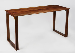 An Australian blackwood occasional table, circa 1960, 75cm high, 151cm wide, 60cm deep