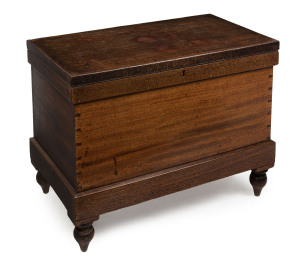 An early Colonial blanket box trunk on turned legs, cedar with iron lock and hinges, New South Wales origin, 19th century, 62cm high, 81cm wide, 46cm deep