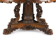 An exhibition quality Anglo-Indian centre table, spectacularly carved in solid padouk, early 19th century, one of the finest examples seen in our rooms. 76cm high, 140cm diameter - 2