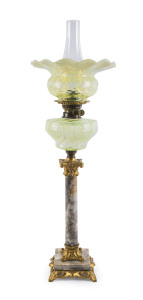 An antique banquet lamp with rare uranium glass shade and font, marble column base with gilt metal mounts and double burner, 19th century, 81cm high