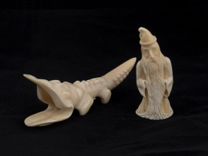 JASPER RASMUSSEN two carved whales teeth in the form of a wizard and a crocodile, the wizard signed "Jasper, Albany", Western Australia, wizard 10cm high
