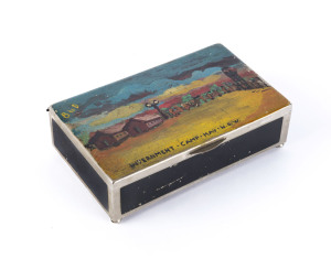 [GERMAN INTERNMENT CAMPS IN AUSTRALIA] c.1942 metal cigarette box with wooden base, which has a hand-painted view on the lid, titled "INTERNMENT - CAMP - HAY - N.S.W." showing two barracks buildings, a stockade, fences and lights and is endorsed "B to D