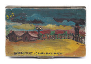 [GERMAN INTERNMENT CAMPS IN AUSTRALIA] c.1942 metal cigarette box with wooden base, which has a hand-painted view on the lid, titled "INTERNMENT - CAMP - HAY - N.S.W." showing two barracks buildings, a stockade, fences and lights and is endorsed "B to D - 2