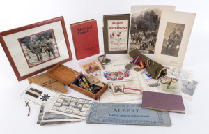 A diverse range in a box mainly WW1 and WW2 era; noted various photographs, postcards, dog tags, a Waltham Army pocket watch, a light-weight surgical set, various badges, medals and miniatures, booklets, a nurses headscarf, letters, military theme cigaret