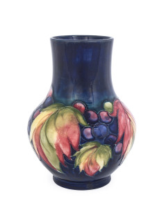 MOORCROFT "Leaves and Berries" pottery vase, circa 1935, incised "Moorcroft, Potters To H.M. The Queen, Made In England", 17.5cm high