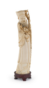 A Chinese carved ivory statue of a scholar, 19th/20th century, seal mark to base, with wooden stand, 33cm high overall
