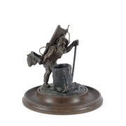 A bronze vesta with woodsman statue, 19th century, ​12cm high